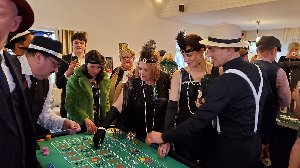 Guests play roulette at a Gastby party