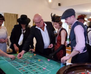 guests-play-roulette-at-themed-birthday-party.jpg guests play roulette at themed birthday party